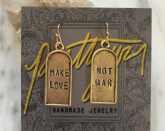 Make Love Not War earrings / gold version