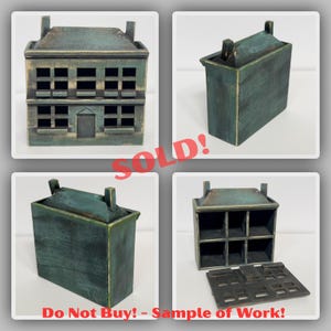 May include: A teal-colored, wooden miniature house with a detailed facade, including windows and a door. The roof has two chimneys. The image includes the text "SOLD!" and "Do Not Buy! - Sample of Work!"