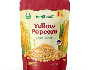 May include: A bag of Pop N Dulge yellow popcorn. The bag is red and cream-colored, with the words "Yellow Popcorn" prominently displayed. The bag also features images of corn on the cob and a pile of popcorn kernels. The bag contains 1 pound of popcorn.