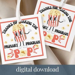 May include: Two white gift tags with red borders and the text "THANKS FOR MAKING THE PRIMARY PROGRAM." Each tag features a cartoon popcorn bucket with a thumbs-up gesture. The word "POP" is in a retro font.