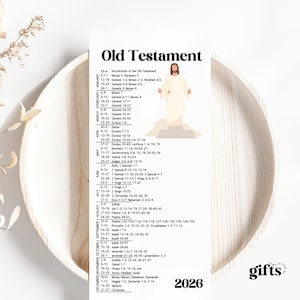 May include: A white vertical calendar print with the text "Old Testament" at the top. The calendar includes a list of biblical readings and a graphic of Jesus. The year "2026" is at the bottom.