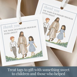 May include: Two square white paper gift tags with a light blue border and a white ribbon loop. The tags feature an illustration of a figure in robes walking with two children in a field, with the text: thank you YOU MADE OUR PRIMARY PROGRAM EXTRA SWEET!