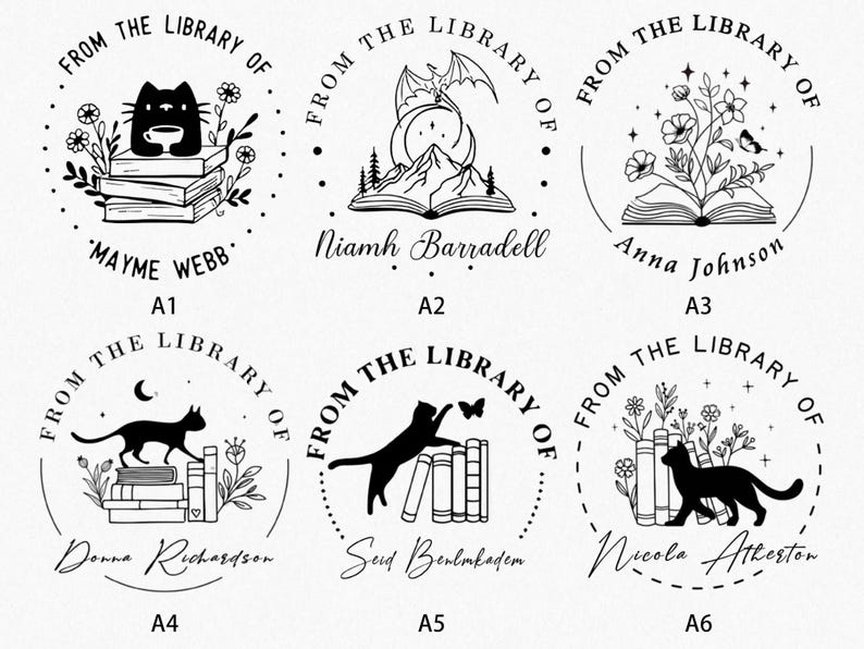 May include: A collection of six black and white library stamps. Each stamp features a circular design with the text "FROM THE LIBRARY OF" and a name. The designs include cats, books, flowers, and a dragon.
