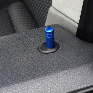May include: A blue metal door handle replacement for a car. The handle is cylindrical and has a textured surface.