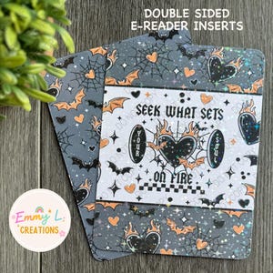 May include: Double-sided e-reader inserts with a black and white design featuring a heart with flames and the text "Seek what sets your soul on fire". The background is a gray pattern with bats, hearts, and spiderwebs.