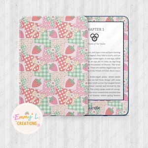 May include: A pink and green Kindle e-reader with a patchwork design featuring strawberries, bows, and gingham patterns. The text "Chapter 1" and "Flame of Tar Valon" is visible on the screen.