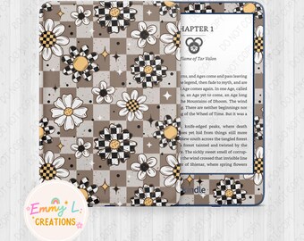 May include: A Kindle e-reader with a brown and white checkered pattern and daisy flowers. The text on the screen reads "Chapter 1 Flame of Tar Valon".