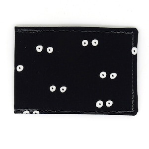 Porta carte Oyster, porta abbonamento autobus, porta tessere viaggio, porta carte. Portafoglio con stampa occhi neri. Portafoglio con carta Oyster, porta carte di credito