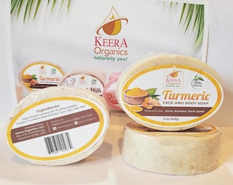 May include: Two bars of turmeric face and body soap, one with the ingredients listed on the back and the other with the product name and description. The soap is a light yellow color and is packaged in clear plastic wrap.