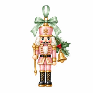 May include: A nutcracker ornament in shades of pink, gold, and black, featuring a soldier uniform, a gold staff, and a hanging bell. The figure is topped with a light green ribbon bow and accented with a sprig of pine needles and red holly berries.