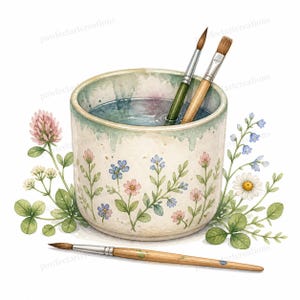 May include: Watercolor illustration of a ceramic cup filled with water and two paintbrushes. The cup is decorated with pink, blue, and white flowers. A third paintbrush rests below the cup, and floral elements surround the cup.