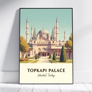 May include: A framed art print of the Topkapi Palace in Istanbul, Turkey. The illustration shows the palace with its minarets, domes, and trees, against a light blue sky. The text "TOPKAPI PALACE" and "Istanbul, Turkey" are at the bottom.