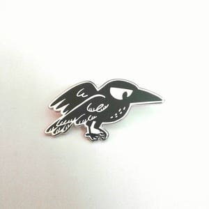 Disdainful Crow enamel pin