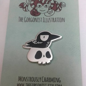 NeverYorick grumpy crow on a skull hard literary goth enamel pin