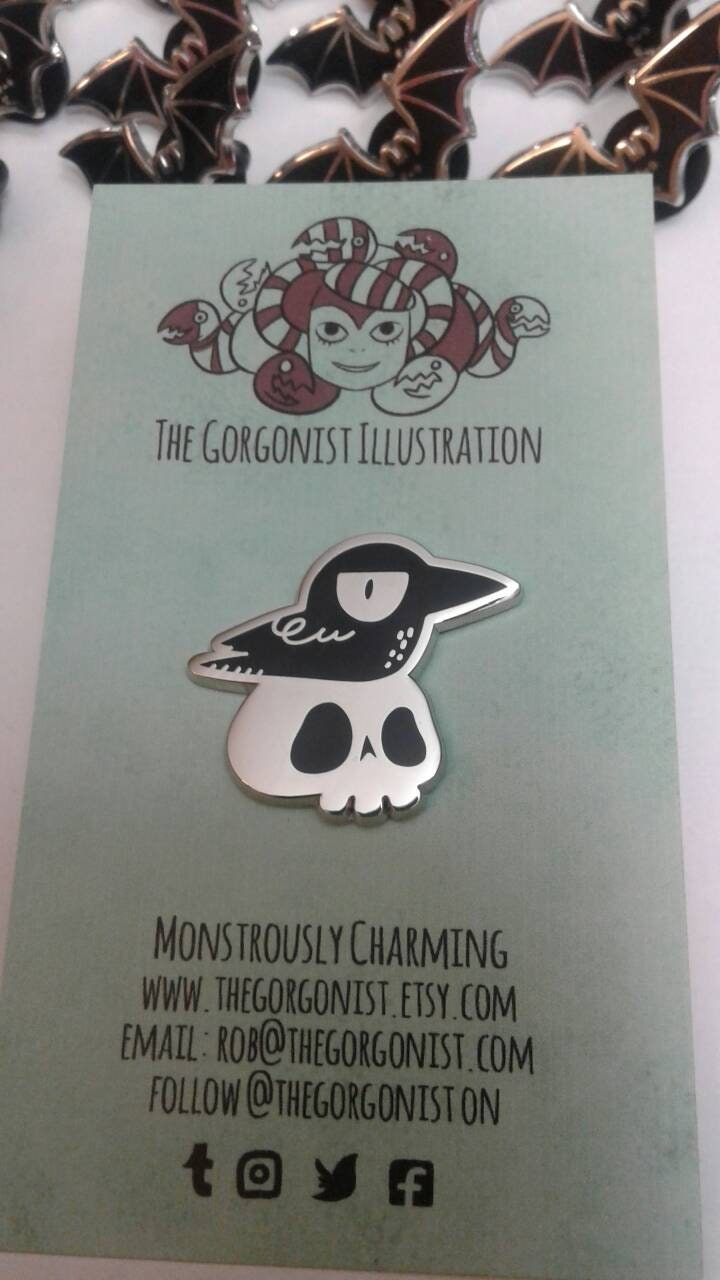 NeverYorick grumpy crow on a skull hard literary goth enamel pin