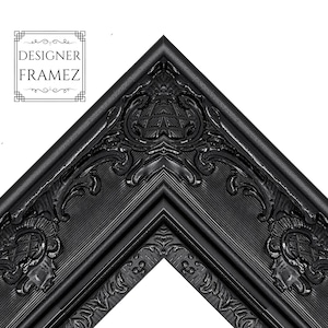 May include: Close-up of a black picture frame corner with ornate, carved details. The frame has a glossy finish and features the text "DESIGNER FRAMEZ" in the upper left corner.