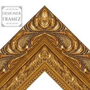 May include: Close-up of a corner of a gold-colored picture frame with ornate, detailed carvings. The frame has a decorative border and features the text "DESIGNER FRAMEZ" in a black and white box in the upper left corner. The frame is set against a white background.