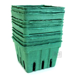 May include: A stack of ten green paper pulp plant pots. The pots are square and have a scalloped edge. The pots are made by BCI Crafts.