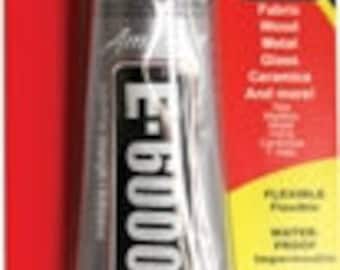 May include: A tube of E-6000 industrial strength adhesive, a clear, strong, flexible, and waterproof glue. The tube is silver with black text and a green cap. The packaging is red and white with the product name and a list of materials it can be used on.