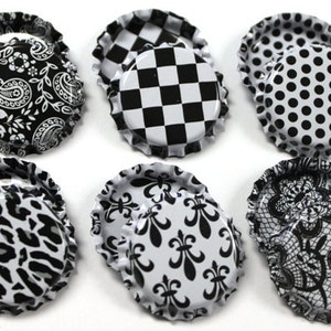 May include: Set of ten black and white bottle caps with various patterns, including paisley, checkered, polka dot, leopard print, fleur-de-lis, and lace.