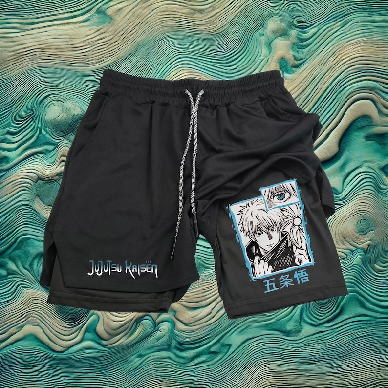 May include: Black athletic shorts with a graphic print of a character from the anime Jujutsu Kaisen. The text "Jujutsu Kaisen" and "五条悟" are printed on the shorts.