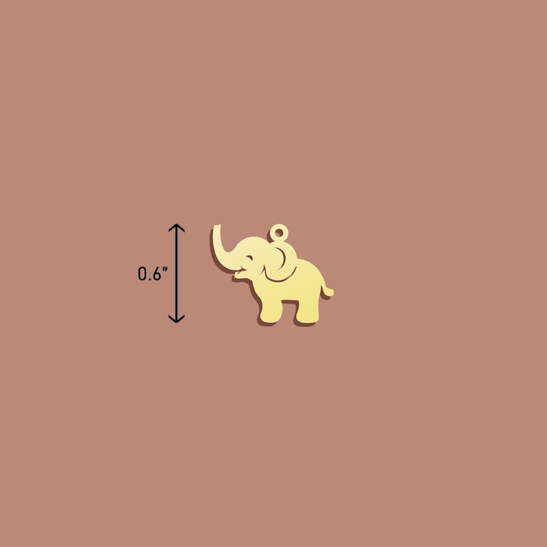 May include: A gold-coloured metal elephant charm, approximately 0.6 inches tall.