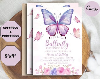 May include: Purple and pink butterfly birthday invitation with a floral border. The text reads "Our Little Butterfly is turning 1. Join us to celebrate Olivia's 1st Birthday. Friday, 23 April | 5:00PM. 1234 Anywhere St., Any City. RSVP at 666-666-666."