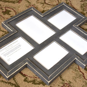 May include: A multi-photo picture frame with a dark gray finish and a distressed, off-white trim. The frame has five openings for photos and a unique geometric design. The text "MOUNTAIN RIVER IMAGES" is visible in one of the openings.