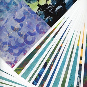 May include: A stack of colorful printed papers fanned out in a radial pattern. The papers are various shades of blue, green, and yellow. The top paper has a pattern of blue circles.