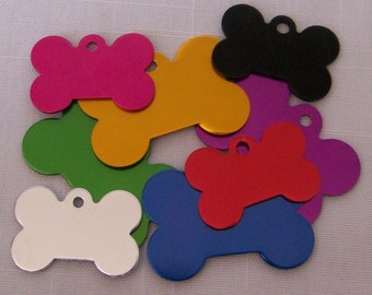 May include: Assortment of colorful bone-shaped dog tags. The tags are made of metal and come in a variety of colors, including red, blue, green, yellow, purple, pink, and black.