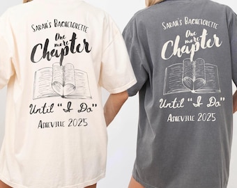 May include: Two white and gray t-shirts with a book graphic and the text "One more chapter" and "Until "I Do" Asheville 2025".