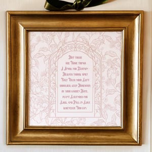 May include: A framed print with a gold-colored wooden frame. The print features a light pink floral background and a central arch with text in a darker pink color. The text reads "But there are some things I know for certain..." and continues with a list of instructions.