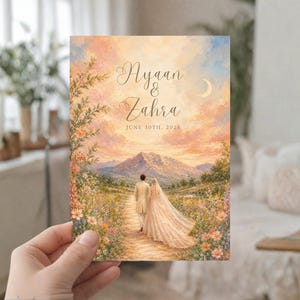 K&ouml;nnte beinhalten: Hochzeitseinladungskarte mit einem Paar, das auf eine Berglandschaft unter einem Sonnenuntergangshimmel zugeht. Die Karte enth&auml;lt die Namen "Ayaan & Zahra" und das Datum "30. Juni 2023". Die Farbpalette ist warm, mit sanften Rosa-, Orange- und Blaut&ouml;nen.