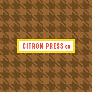 May include: A brown and white houndstooth pattern background with a yellow rectangle containing the text "CITRON PRESS CO" in red.