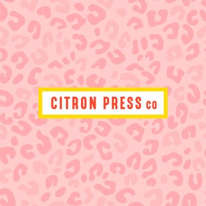 May include: Pink background with a repeating pattern of light pink leopard spots. A yellow rectangle with the text "CITRON PRESS CO" in red letters is centered on the image.