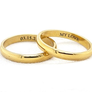 May include: Two gold wedding bands, one engraved with "MY LOVE" and the other with "03.15.20".