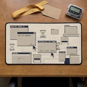 May include: A rectangular desk mat featuring a retro computer desktop interface design with error message windows, including text like RUNTIME ERROR 22, OUT OF MEMORY, and SYSTEM32.DLL NOT FOUND, alongside icons of floppy disks, folders, and hourglasses.