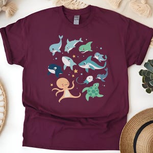 Orcas shirt Cartoon Ocean Animals Dance Circle T-Shirt Whimsical Marine Life Illustration Marine Biology Enthusiast Top Heavy Cotton Comfort