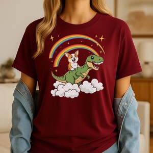 Cartoon corgi shirt Riding T-Rex Rainbow Adventure Cosmic Night Dinosaur Lovers Playful Pet Enthusiast Tee Bold Whimsical Illustration