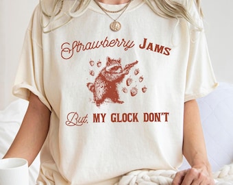 Strawberry Jams But My Glock Don't T-Shirt , Funny Racoon T-Shirt, Funny Meme Shirt, Funny Racoon Shirt, Strawberry Jam Shirt, Western Tees