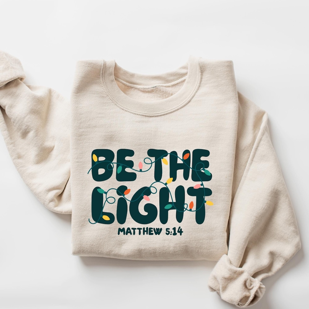 Be The Light Sweatshirt, Religious Christmas Sweatshirt, Christian Holiday Sweater, Faith Based Gift, Christmas Gifted, Festive Apparel Teemarvel Onlyshirt