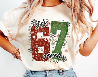 Cute Christmas 67 Shirt, Six Seven Holiday T-Shirt, Festive Red Green Lights Tee, Merry Christmas Outfit, Cute Holiday Gift, Christmas Day