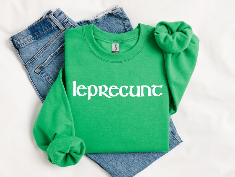 May include: A green sweatshirt with the text "leprecunt" in white lettering.