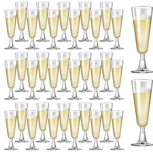 May include: A collection of clear champagne flutes filled with a golden liquid. The glasses have a classic design with a long stem and a slender bowl. The image showcases a variety of flutes, perfect for celebrations and events.