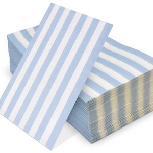 May include: A stack of rectangular paper napkins featuring a repeating pattern of vertical light blue and white stripes. The napkins are folded and arranged in a neat pile, showing the consistent striped design across the top and side edges.