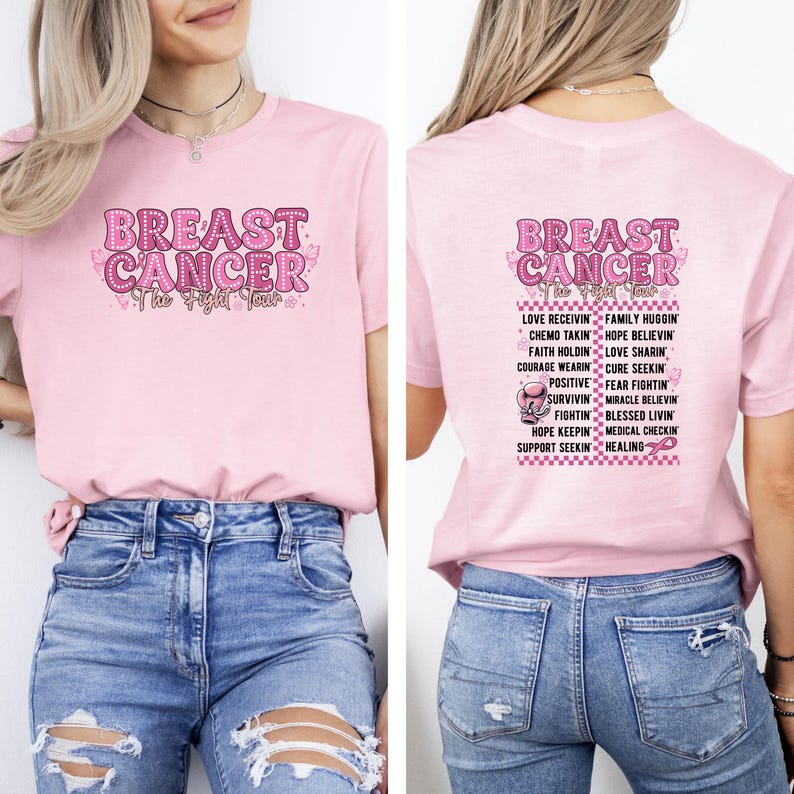 May include: A light pink t-shirt with the words "BREAST CANCER" in a pink, textured font. The front of the shirt has the text "The Fight Tour". The back of the shirt has a list of words related to breast cancer awareness.