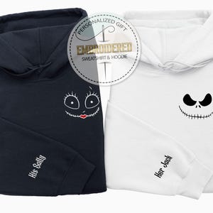 May include: Two hooded sweatshirts, one black and one white, featuring embroidered character faces. The black hoodie has a Sally face, the white one a Jack face. Sleeves are labeled "His Sally" and "Her Jack". The image includes a "Personalized Gift" graphic.