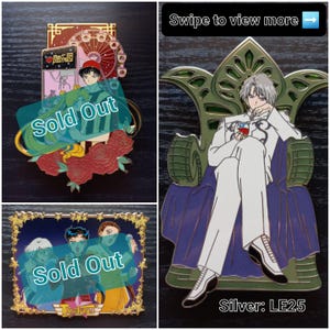 Può includere: Una collezione di tre spille in smalto con personaggi in stile anime. Una spilla mostra un personaggio su un trono con il testo 'Silver: LE25'. Altre due spille mostrano personaggi in varie ambientazioni con la scritta 'Sold Out' in sovrimpressione.