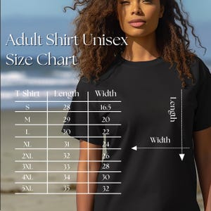 May include: Black t-shirt with a size chart for adult unisex shirts. The chart displays measurements for length and width in inches for sizes S through 5XL. The text "Adult Shirt Unisex Size Chart" is at the top.