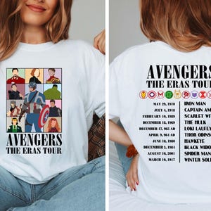 May include: White t-shirt with a graphic of the Avengers characters and the text "Avengers The Eras Tour". The back of the shirt has a list of the Avengers characters and their first appearances.